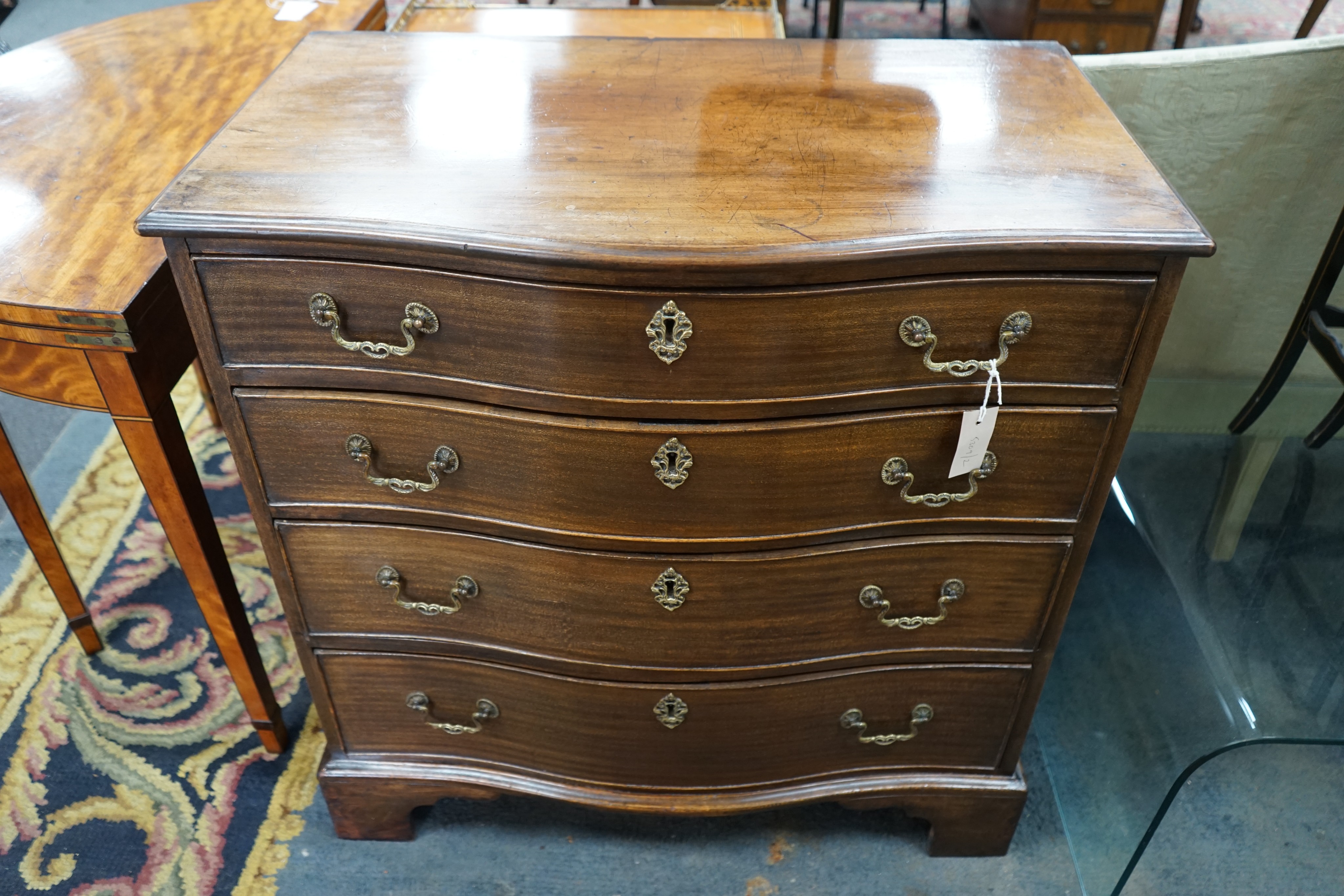 A George III mahogany four drawer serpentine chest, width 84cm, depth 49cm, height 86cm